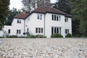 House exterior with surrounding yard and driveway
